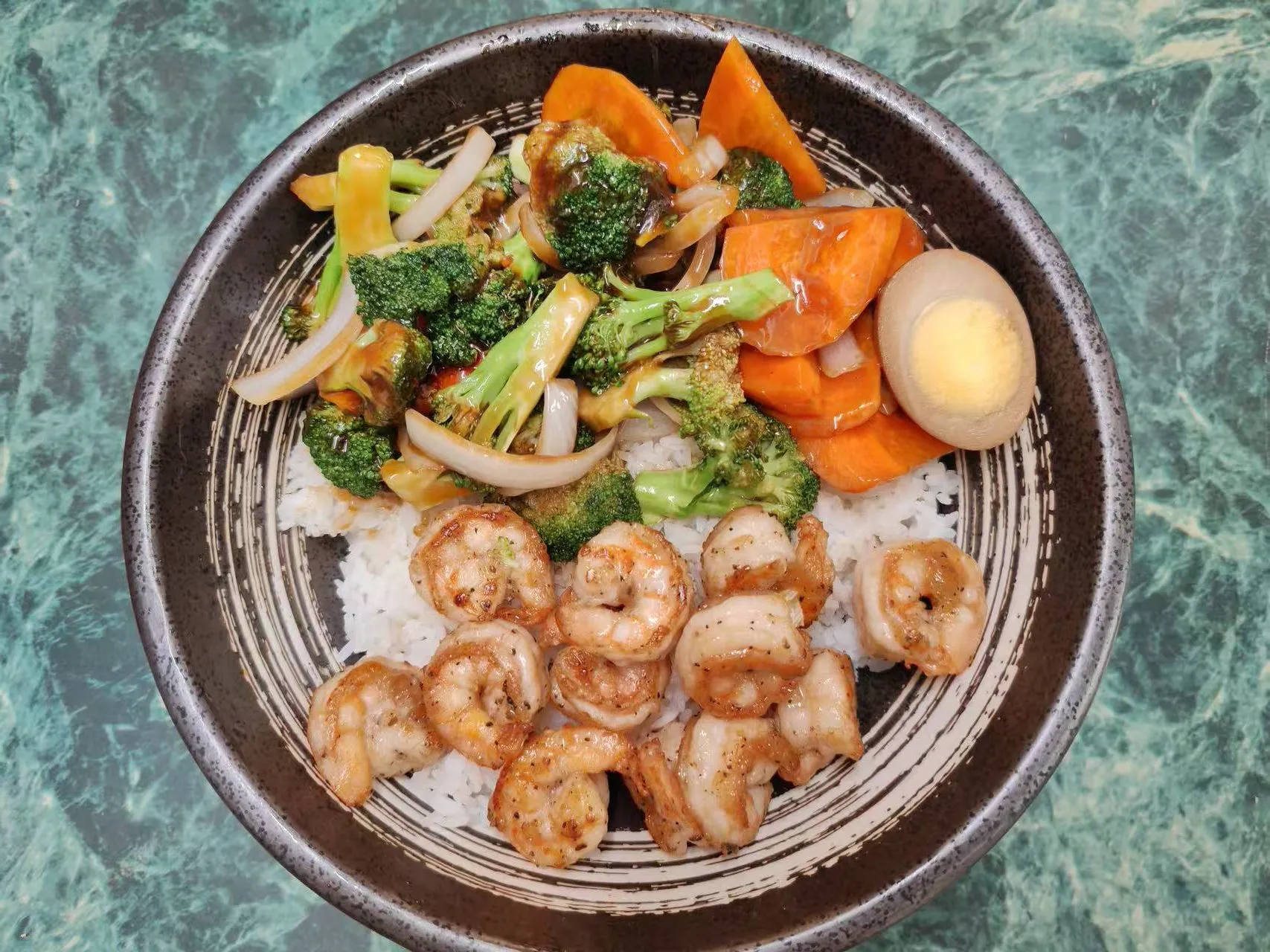 Shrimp rice bowl with broccoli, carrot, onion and marinated boiled egg at Asia Hibachi & Rice Bowls，an Asian Fusion Restaurant in Buffalo
